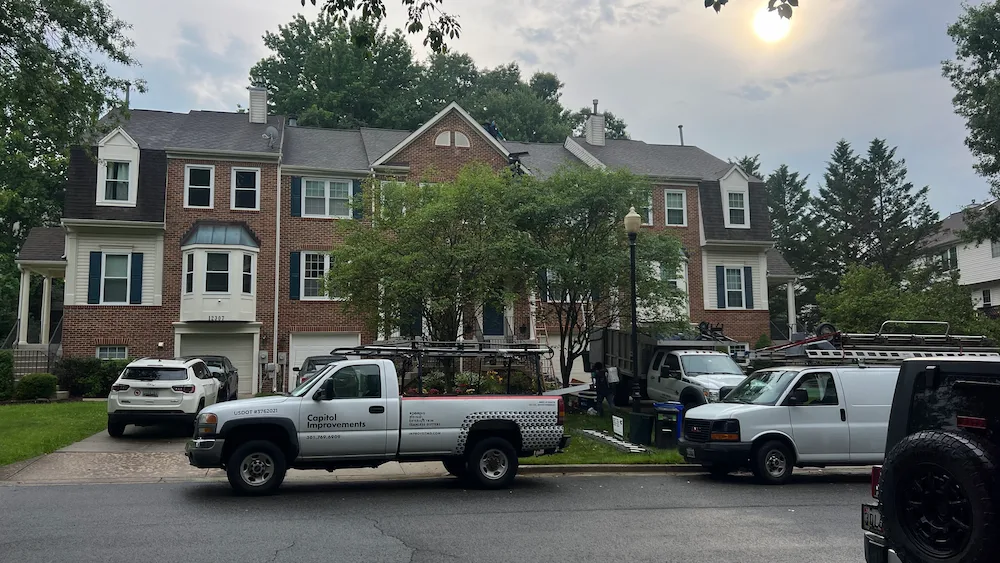 Roofing crew working late on townhome install in Bowie MD to finish second job of the day