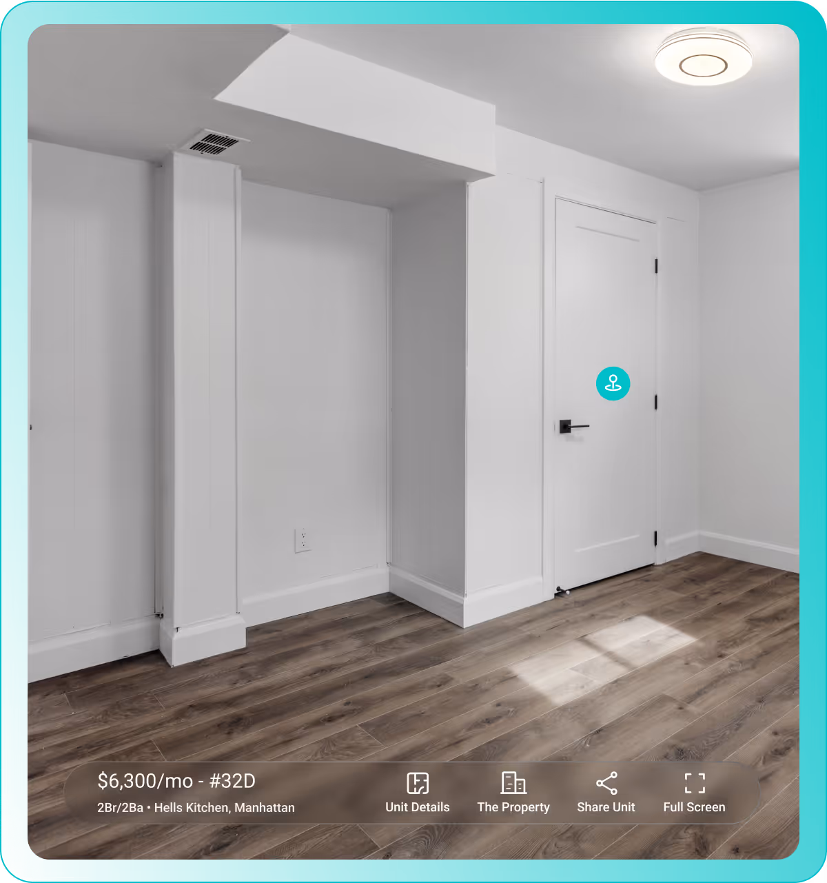 Empty room with white walls, a closed white door, ceiling light, and wood flooring with sunlight patch.