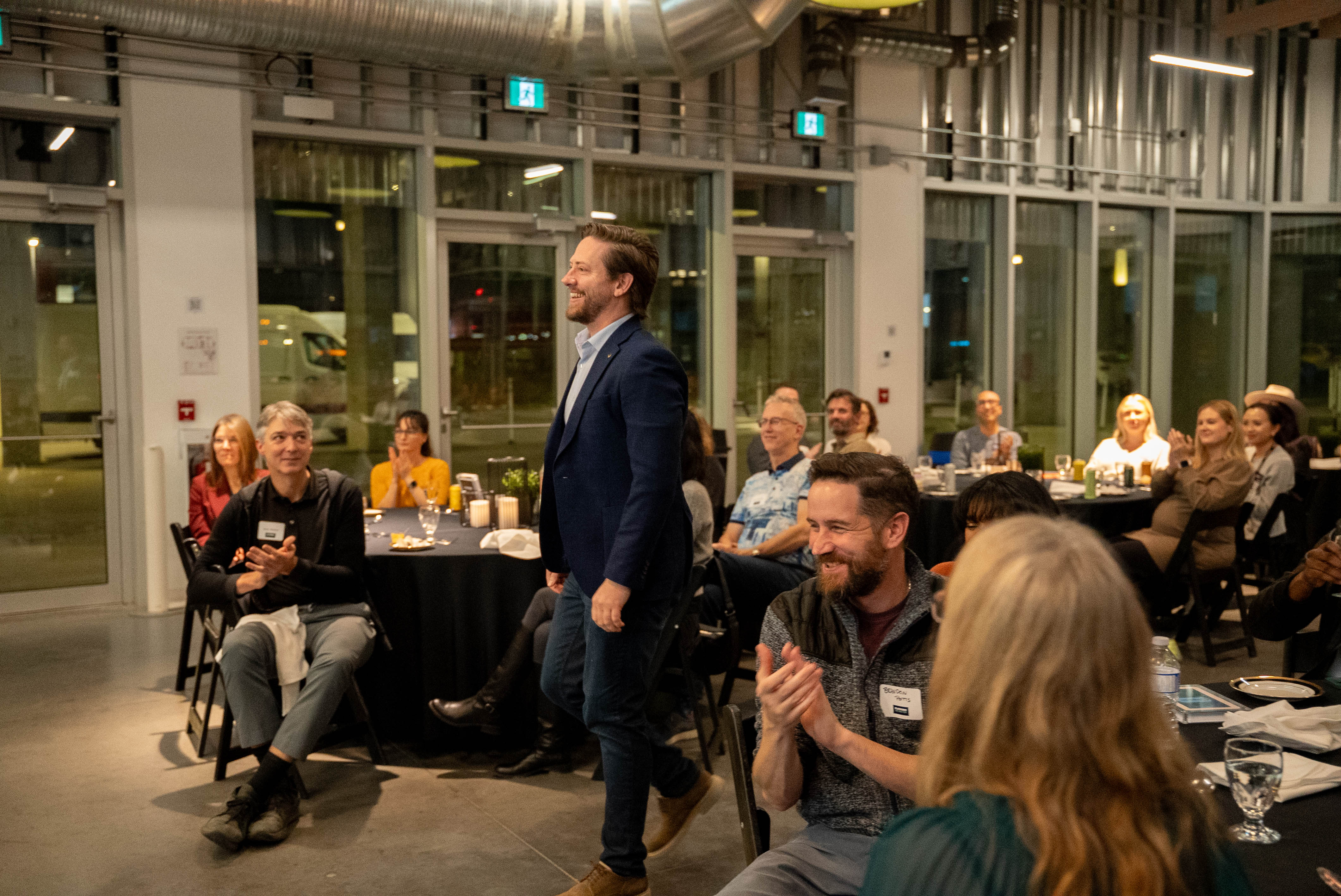 Founder Cameron Raynor of everyanswer walking up to receive startup award
