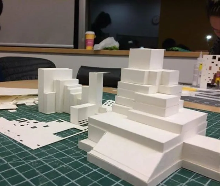 Cardstock paper being shaped into rectangular blocks