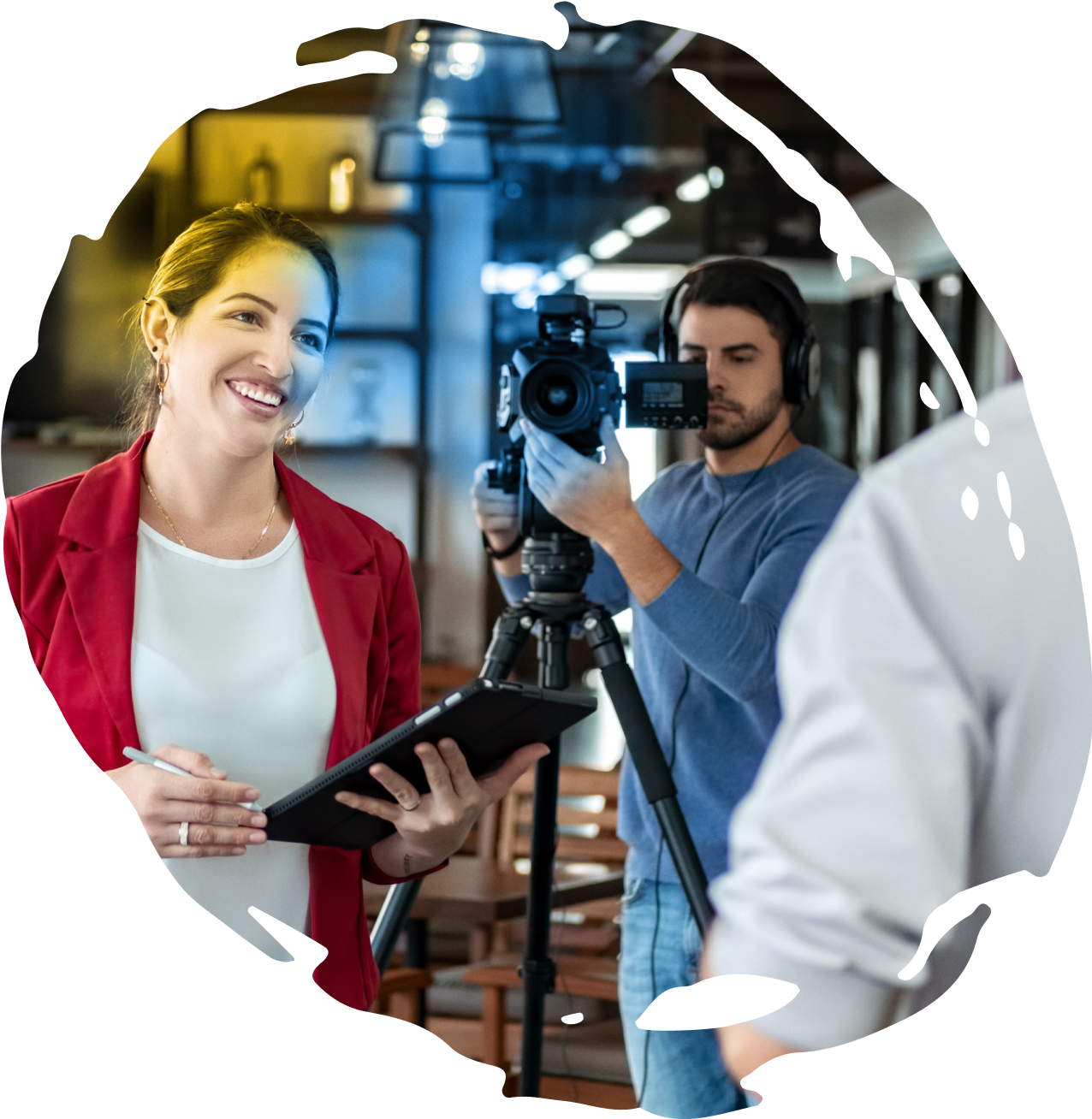 A film crew interviewing their subject