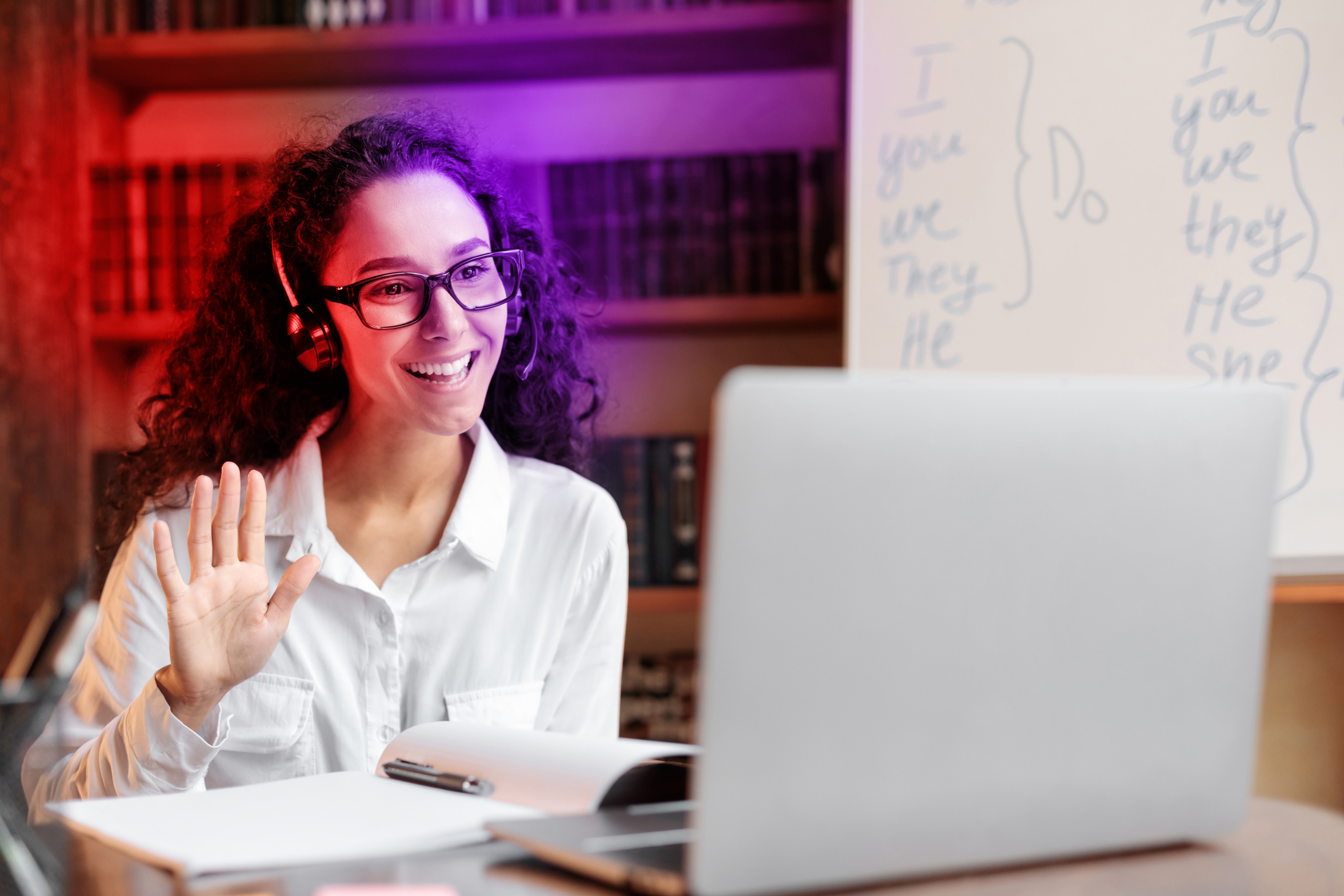 A woman completing a virtual onboarding experience on her laptop