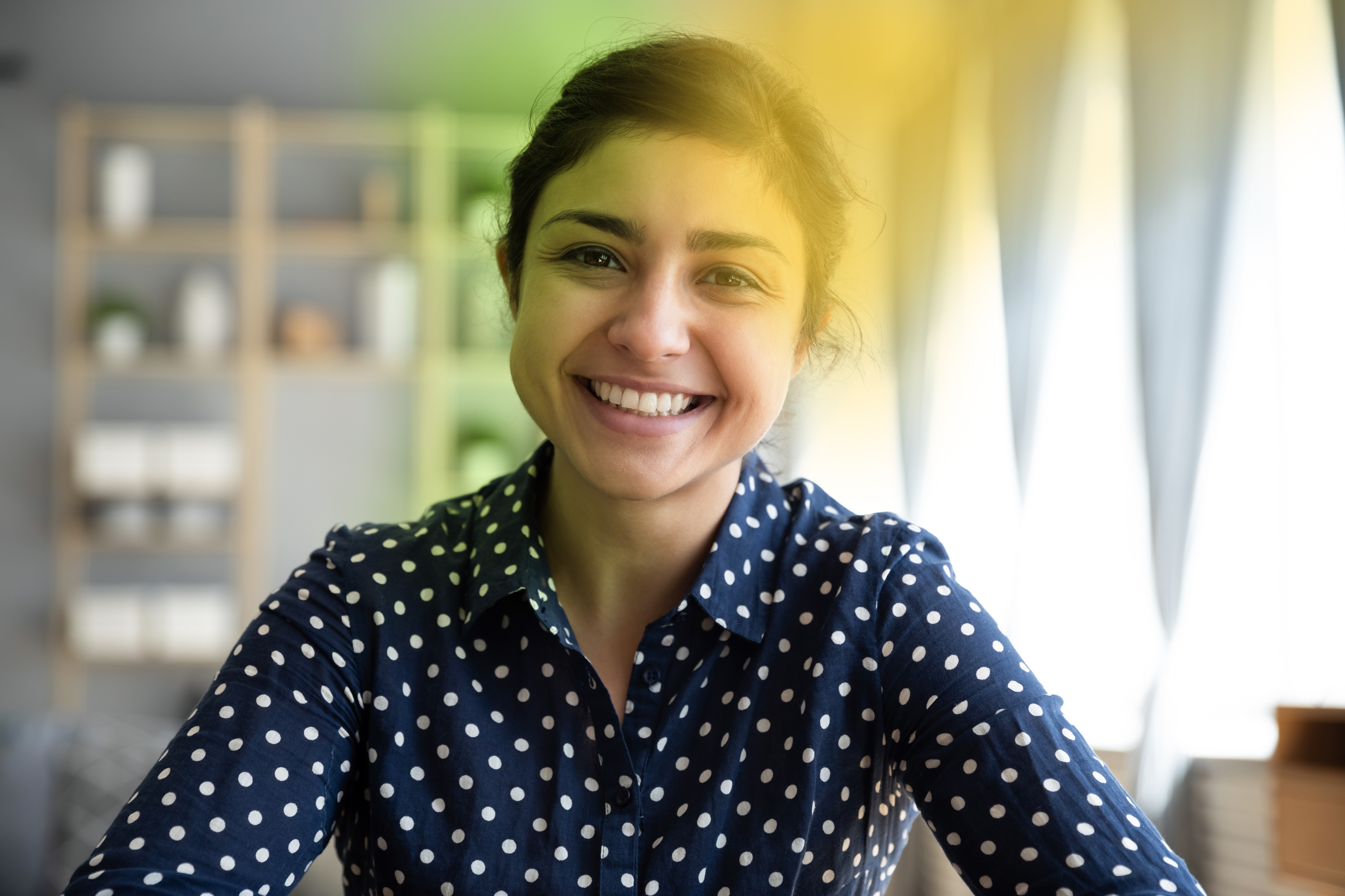 A woman smiling because she understands her purpose at work