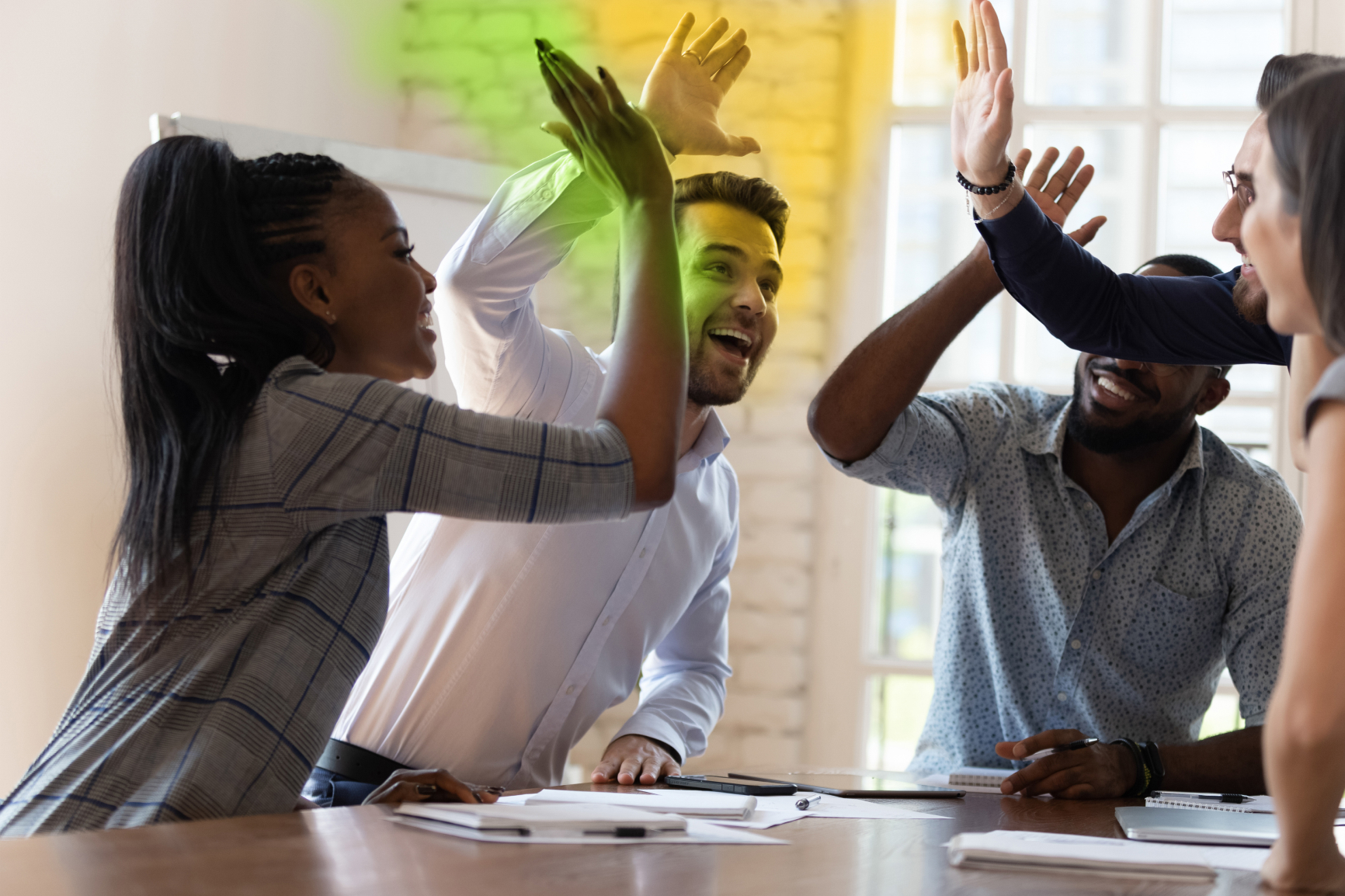 Two colleagues high-fiving