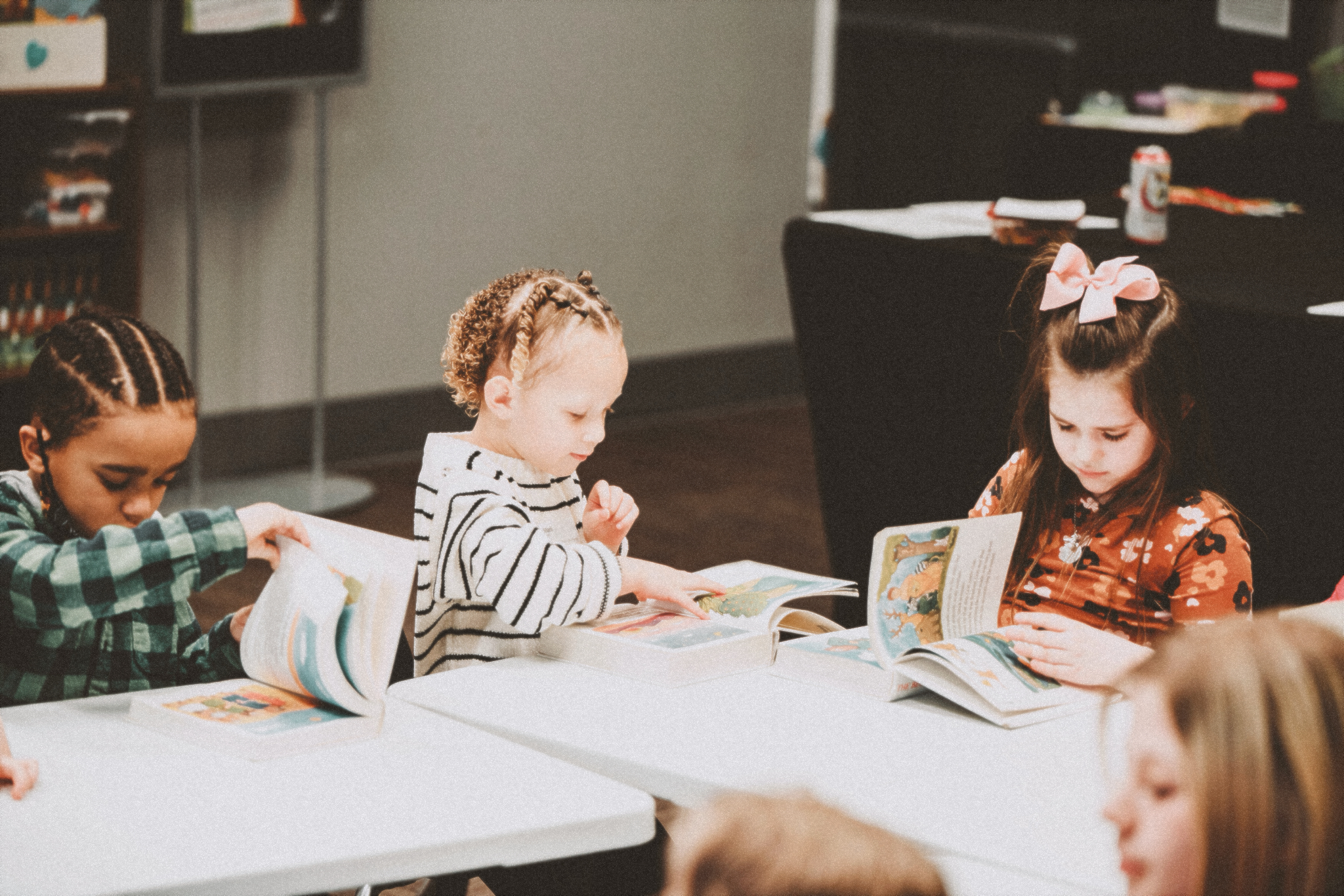 A group of little ones from Harvest Kids reading through their lessons.