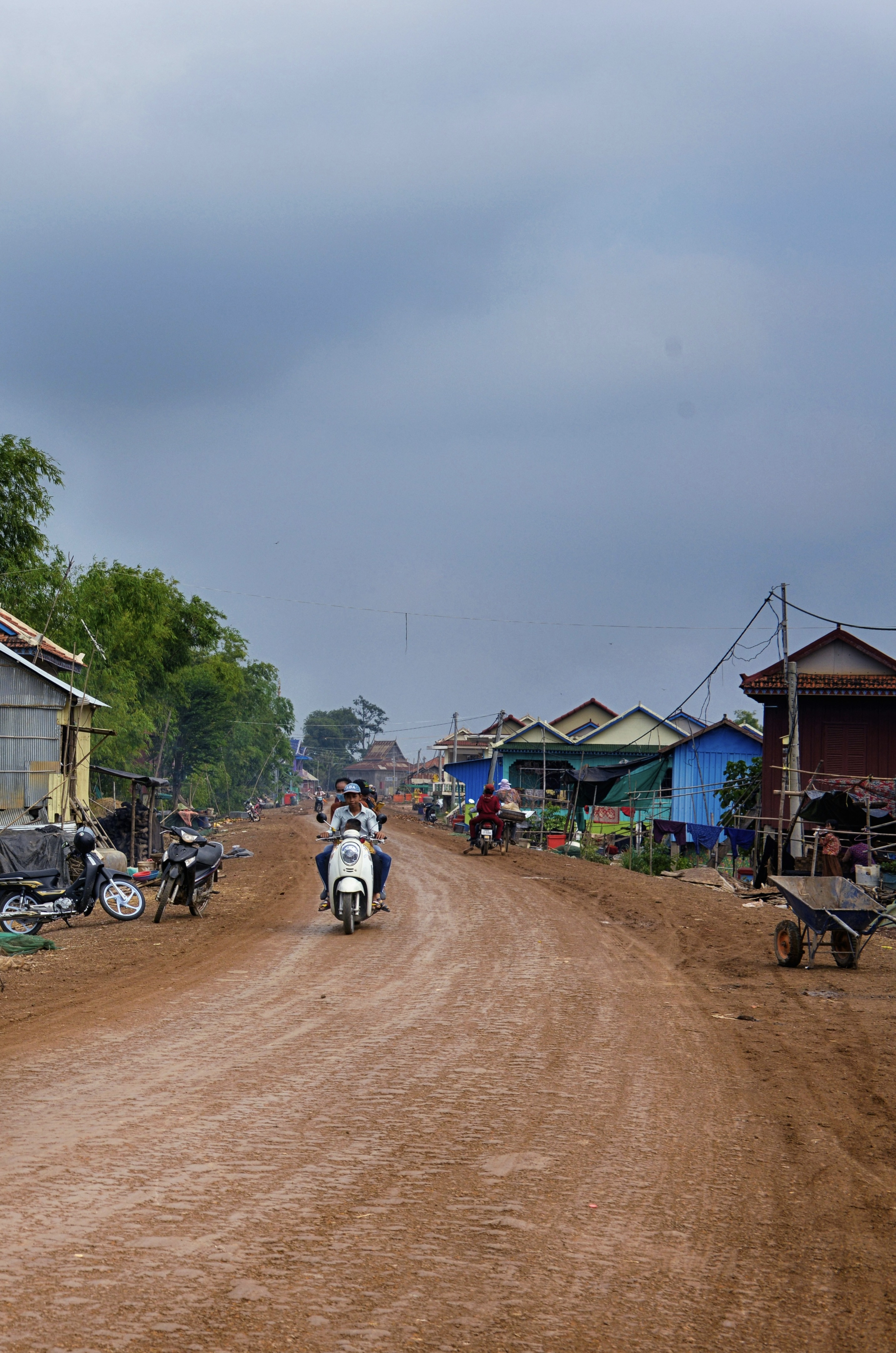 A dusty dirt road that runs through a small town in Cambodia. 

Credit: allphoto-bangkok-fHLqRr2b7CU-unsplash