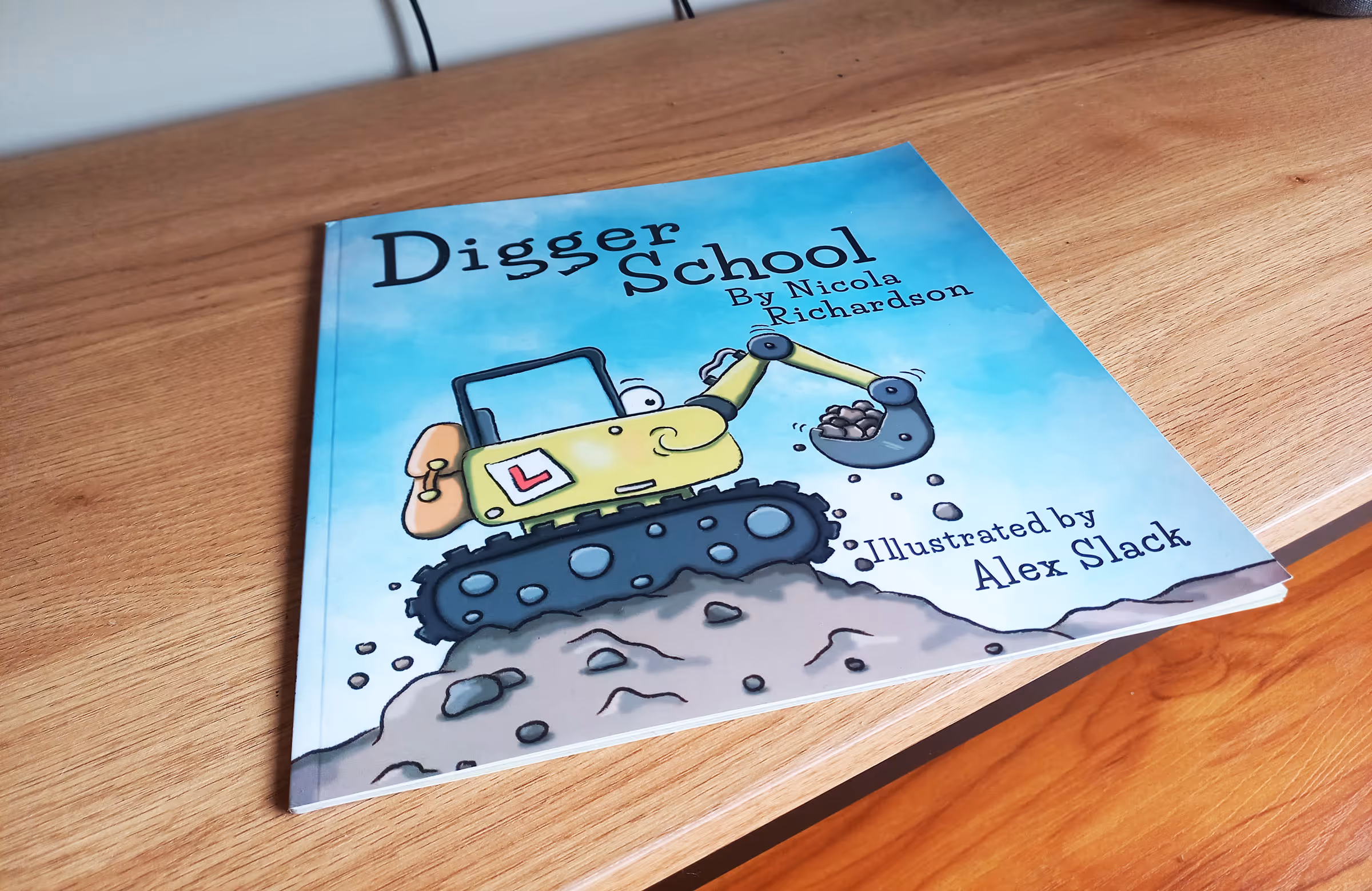 The digger school book on a wooden floor