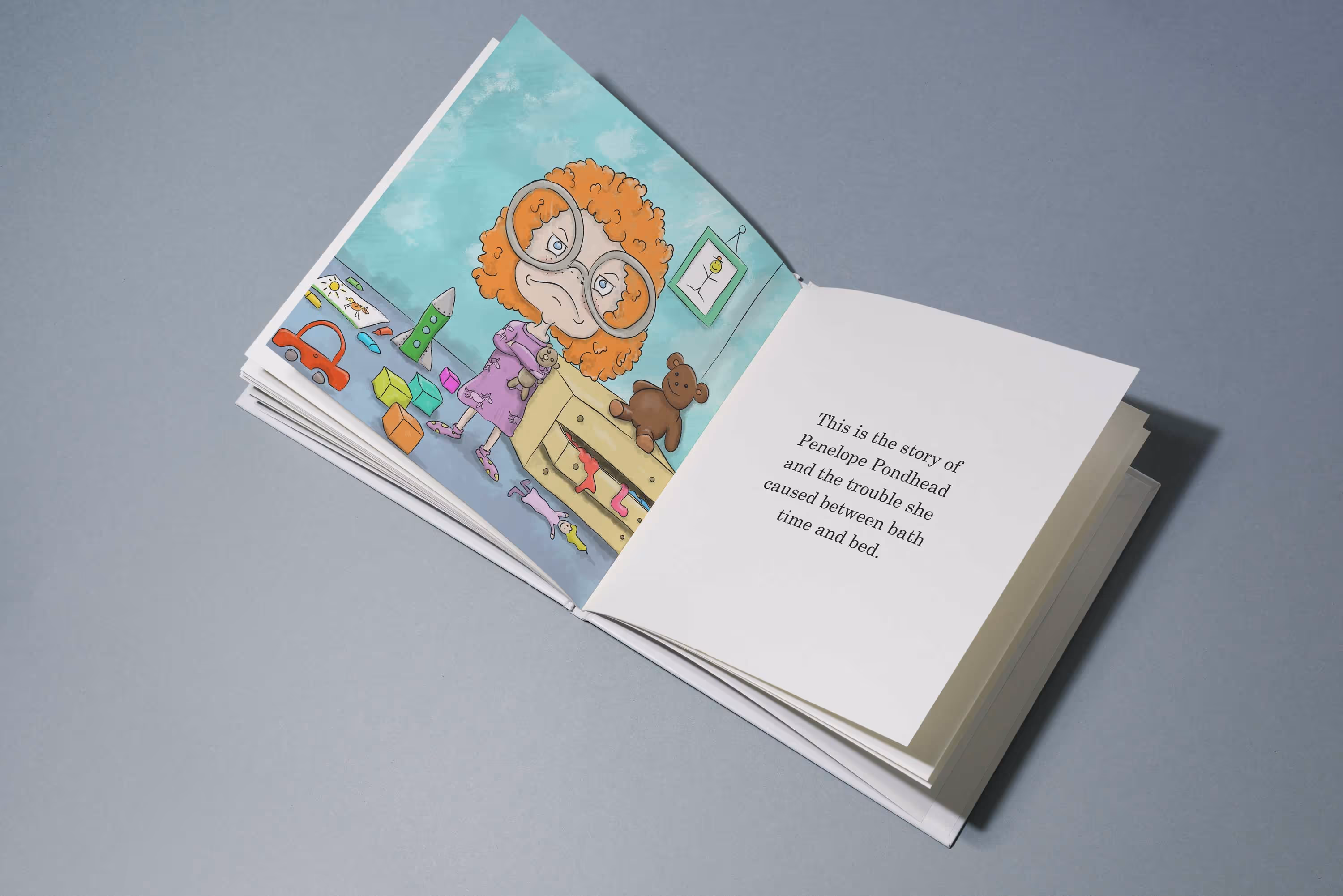 An open page from the Penelope Pondhead book. One page is an illustration of a young cartoon girl and the other is text from the book.