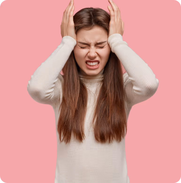 a person holding her head with her hands