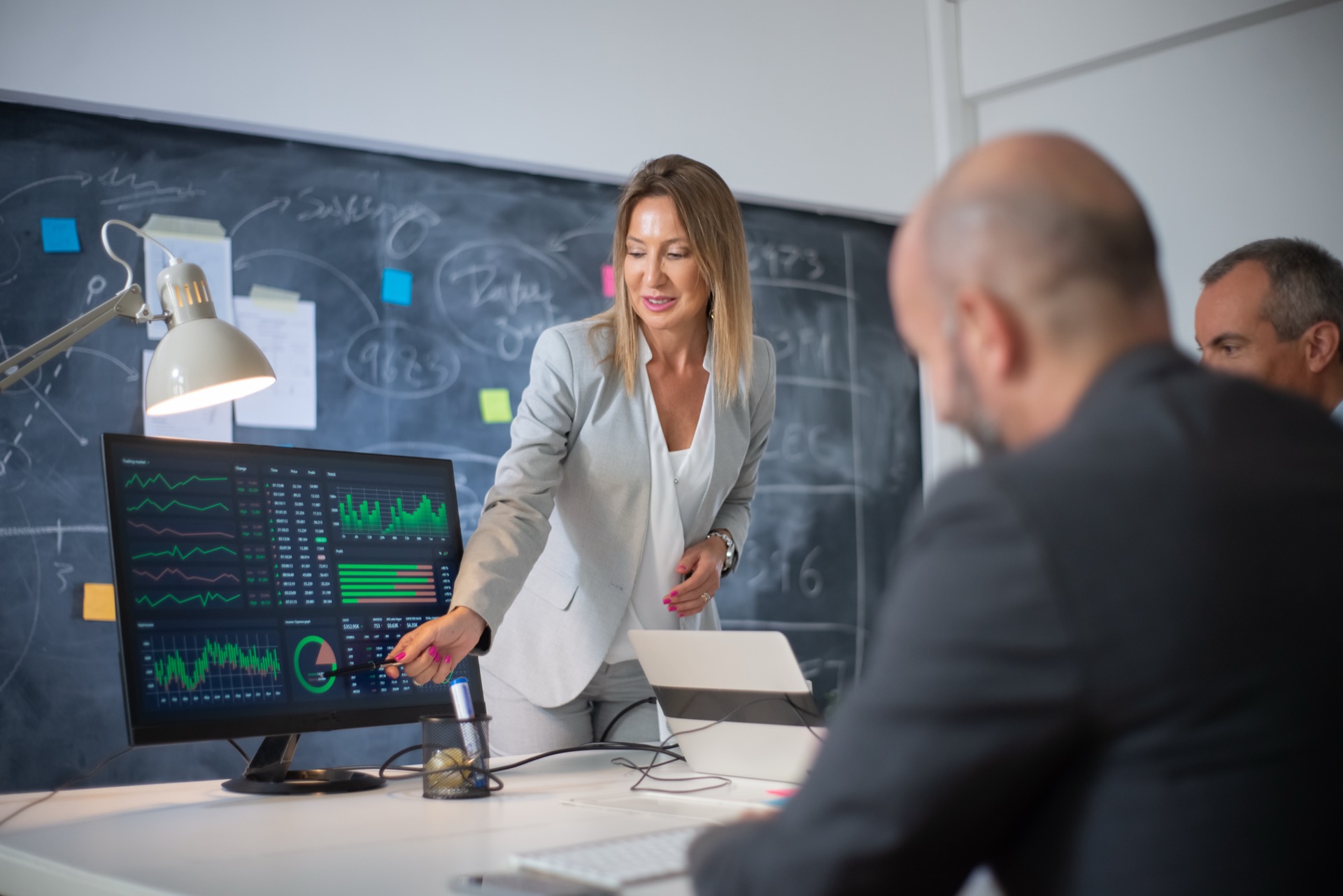 Marketing team reviewing partner audience data on a dashboard