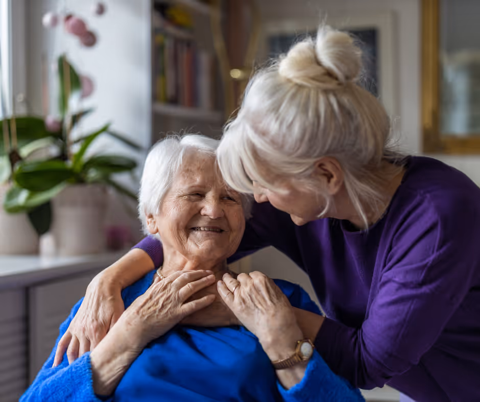 senior in elderly home with caretaker - Milford elder law attorney concept