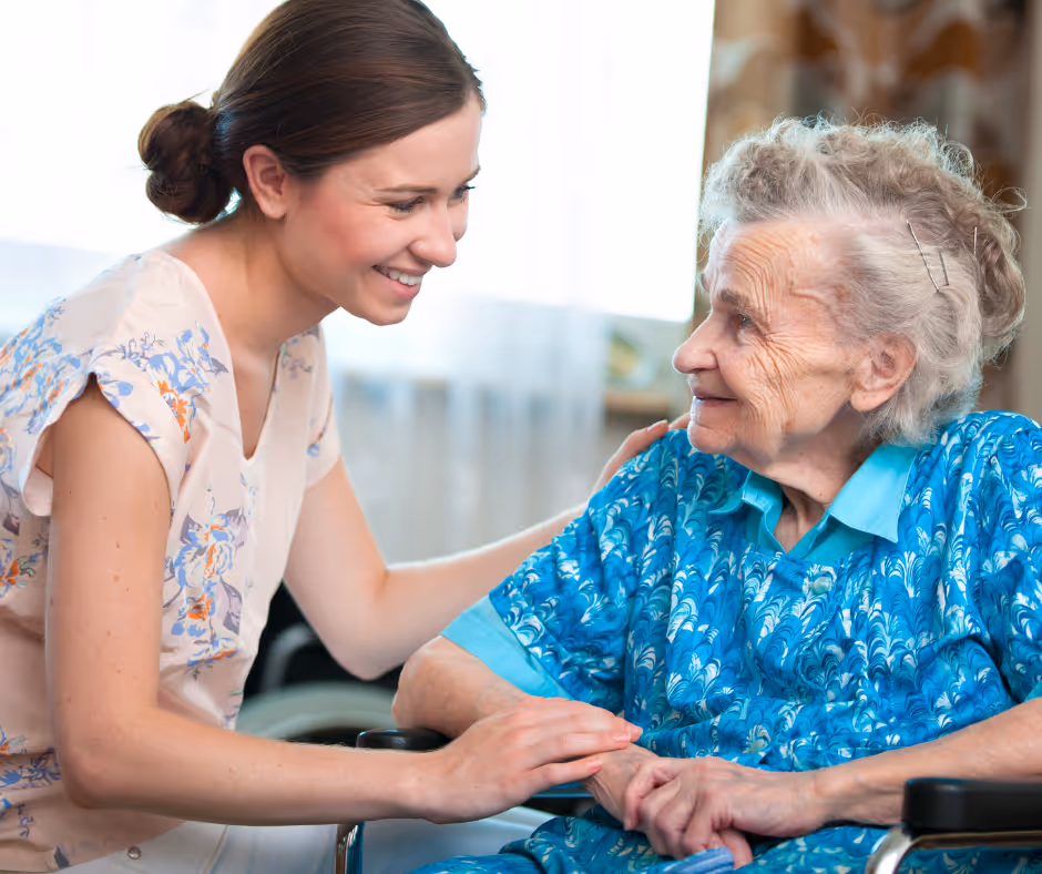 caregiver with senior in wheelchair - milford elder law attorney concept