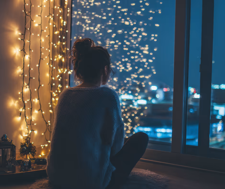 women grieving looking out a window near christmas lights Milford estate planning attorneys