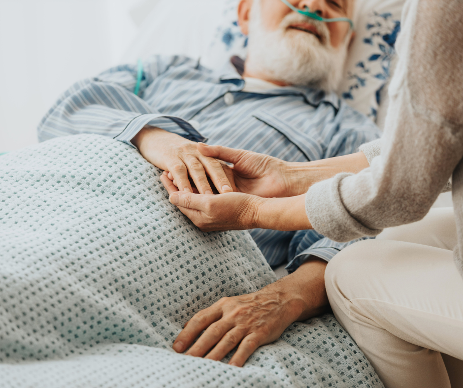 caregiver holding elderly man's hand - Trumbull will lawyer