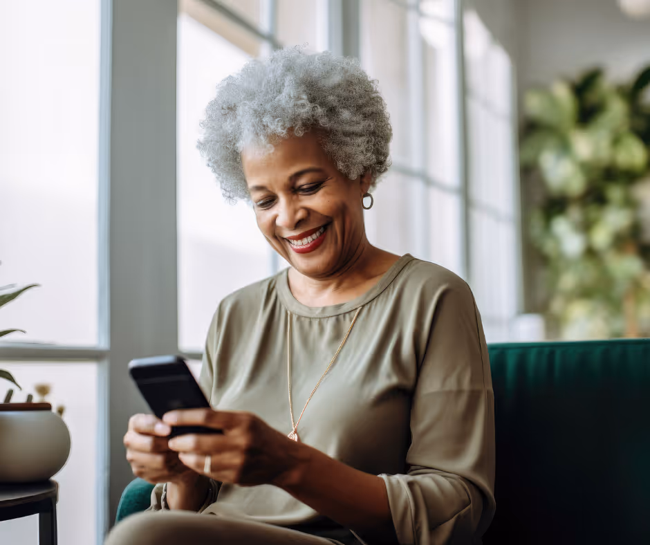 elderly woman looking at phone - Trumbull elder law planning concept