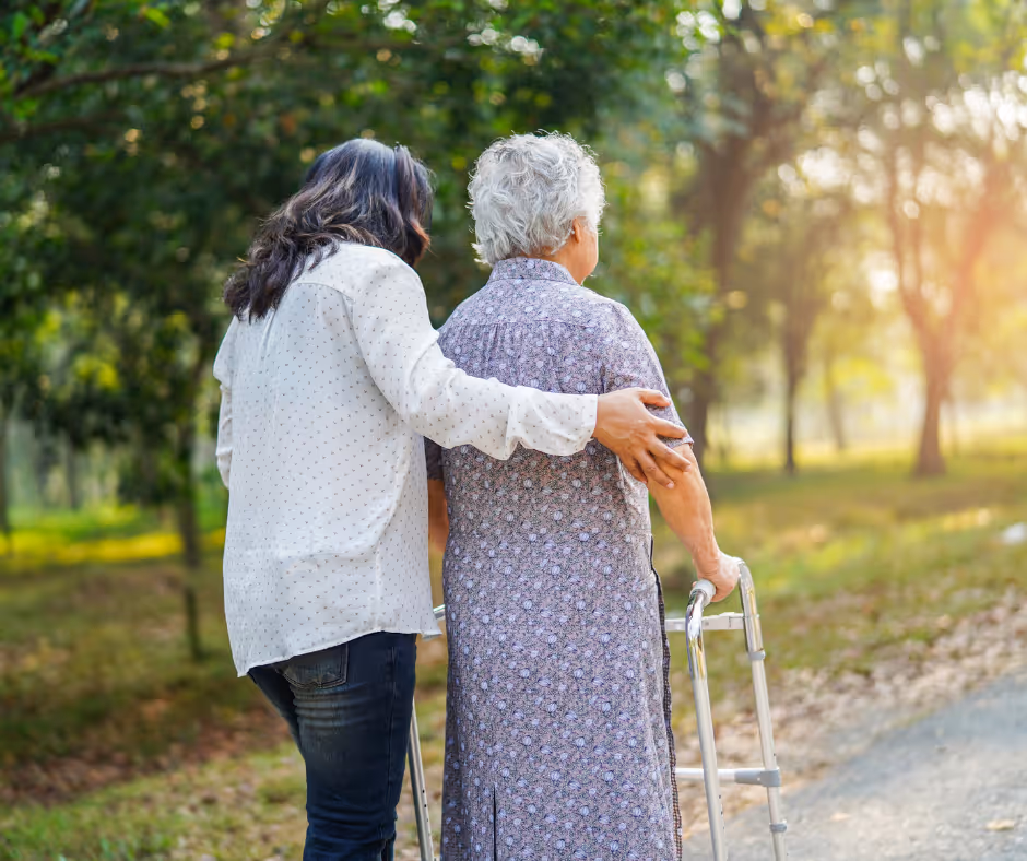 woman caring for elder patient while walking - elder care options in New Haven County concept