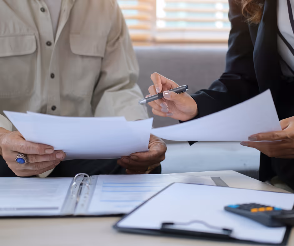 people looking at estate planning documents - Milford estate attorney concept
