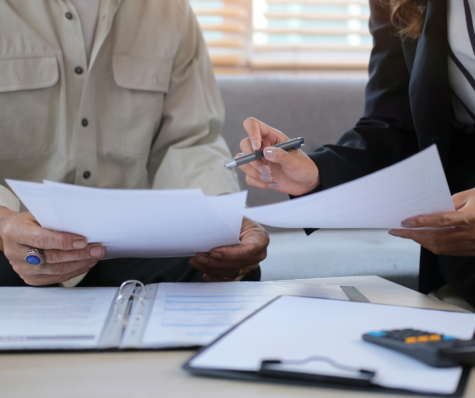 people looking at estate planning documents - Milford estate attorney concept