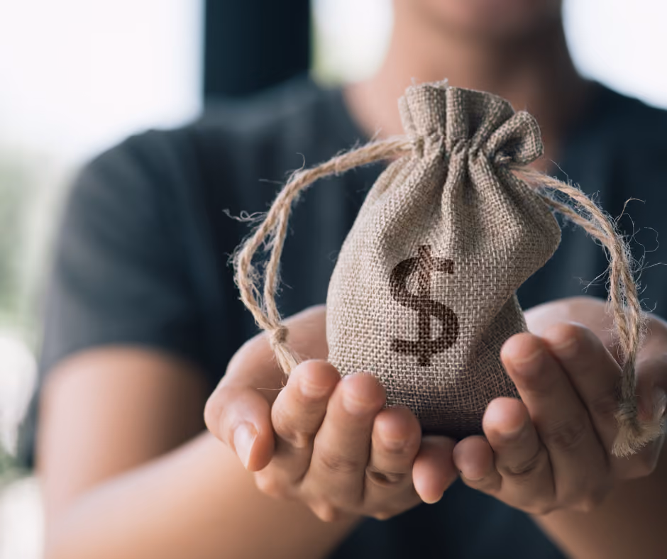 woman holding up bag of money in sack - probate in New Haven County concept
