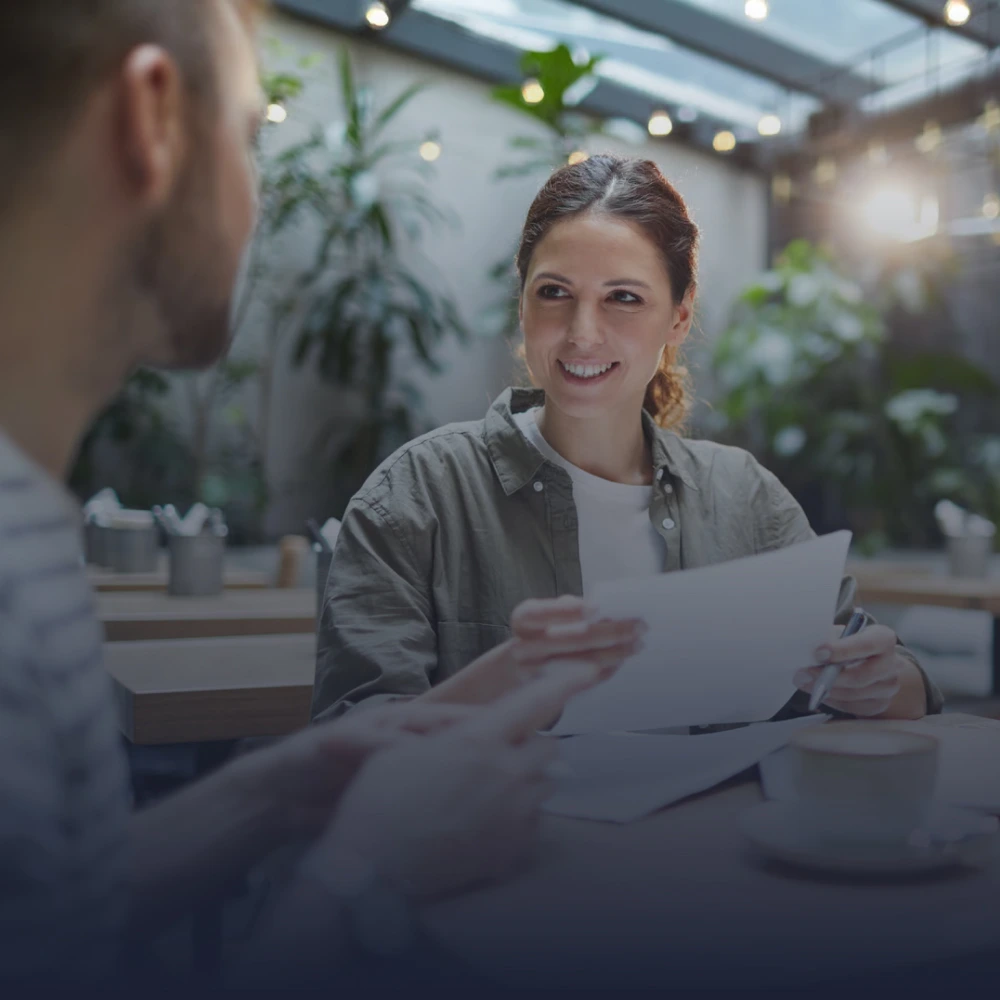 Business owner evaluating SEO prices with a Sparqflow team member.