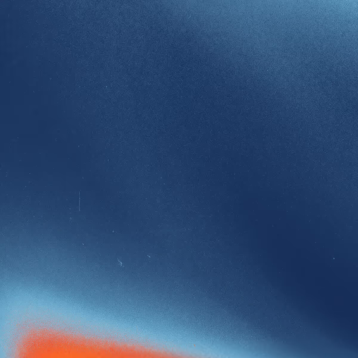 Abstract image with dark blue background fading to light blue and red at the bottom left corner.