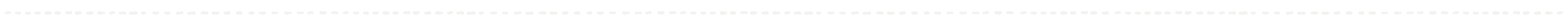 Horizontal line of small, evenly spaced white dots on a transparent background.