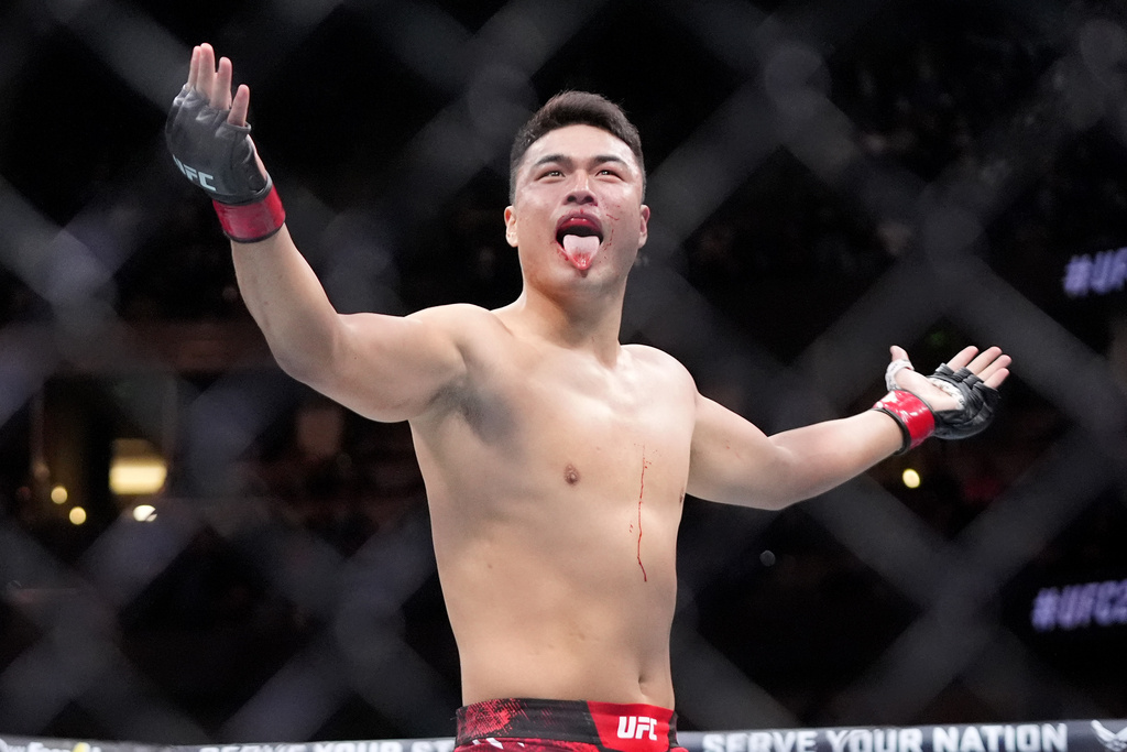 Zhang Mingyang celebrates a UFC win. Walker vs. Zhang is the main event at UFC Shanghai Fight Night on Saturday, Aug. 23.