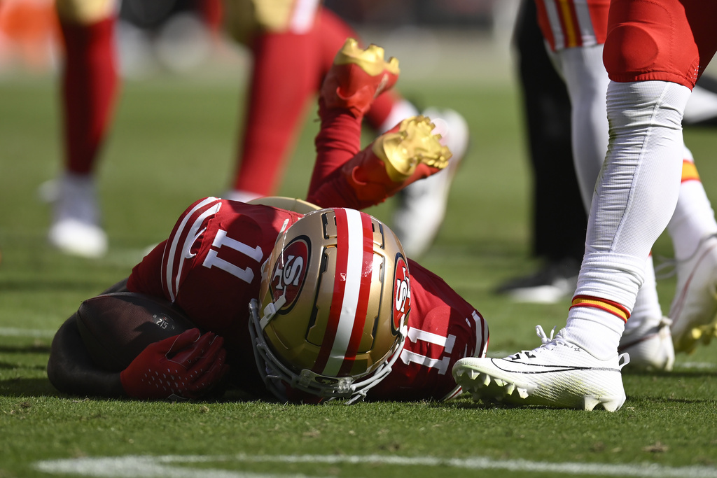 49ers WR Brandon Aiyuk remains on teh field after a hit during an NFL game vs. the Chiefs on Oct. 20, 2024.