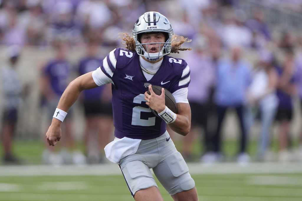 Kansas State QB Avery Johnson runs during a college football game.