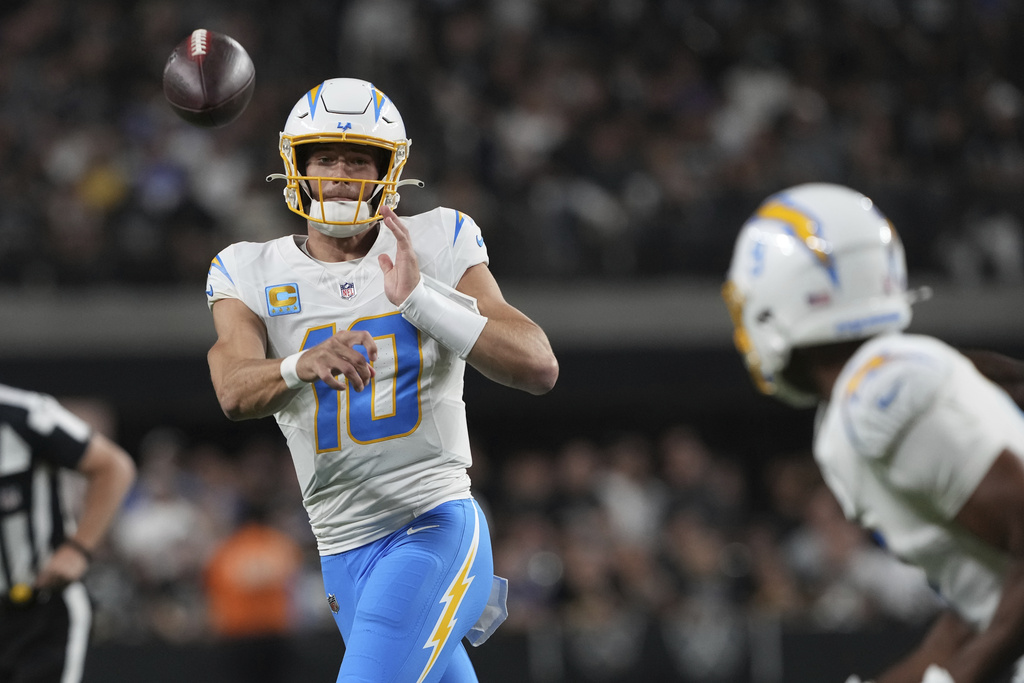 Chargers QB Justin Herbert throws a pass in an NFL game. Justin Herbert is a top PrizePicks NFL pick in Week 3 in the Broncos vs. Chargers game.