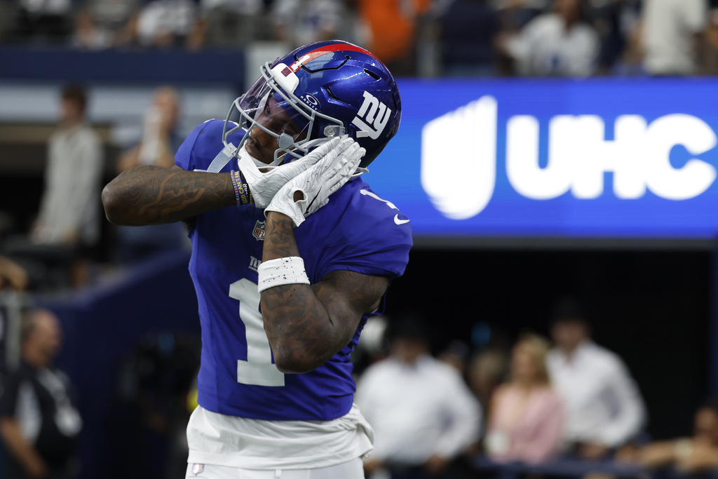 Giants WR Malik Nabers celebrates a touchdown in an NFL game.