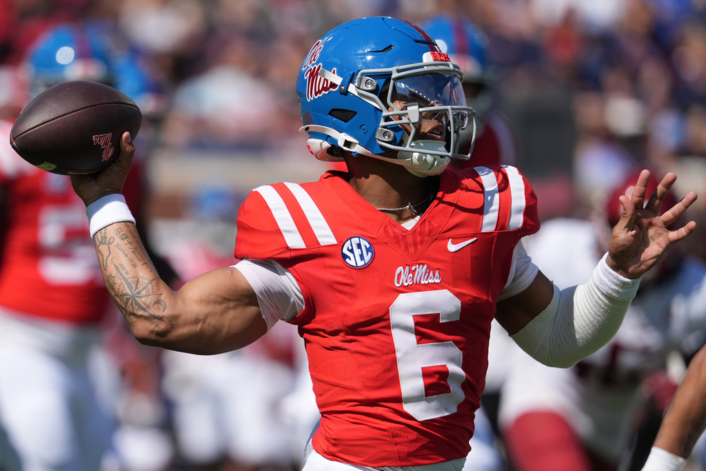 Ole Miss QB Trinidad Chambliss throws a football in a CFB game.