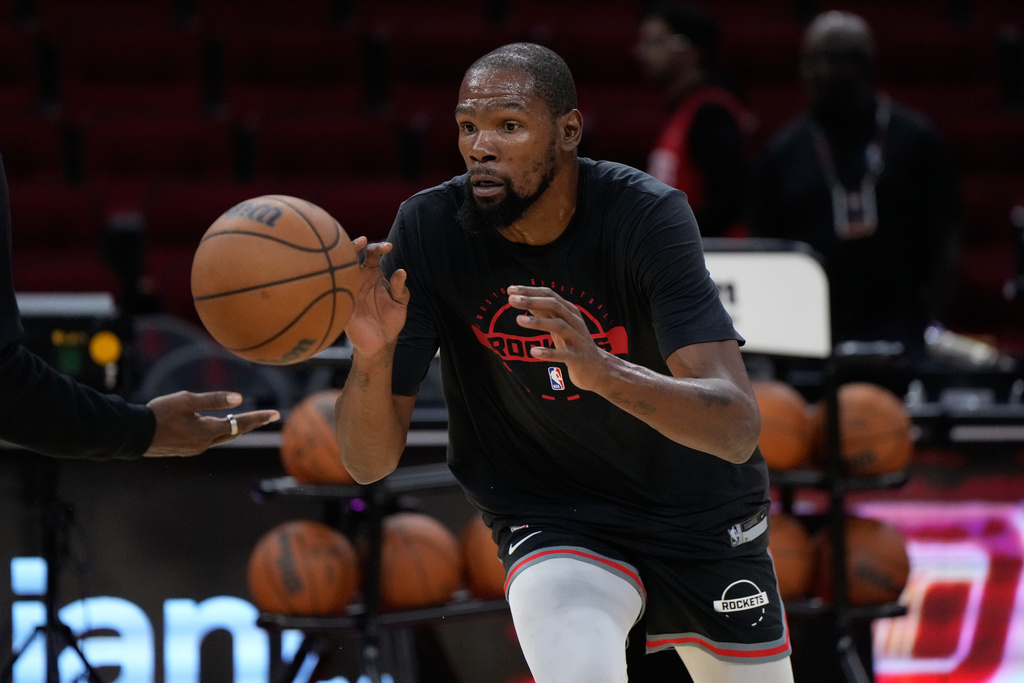 Rockets F Kevin Durant dribbles a basketball before an NBA game.
