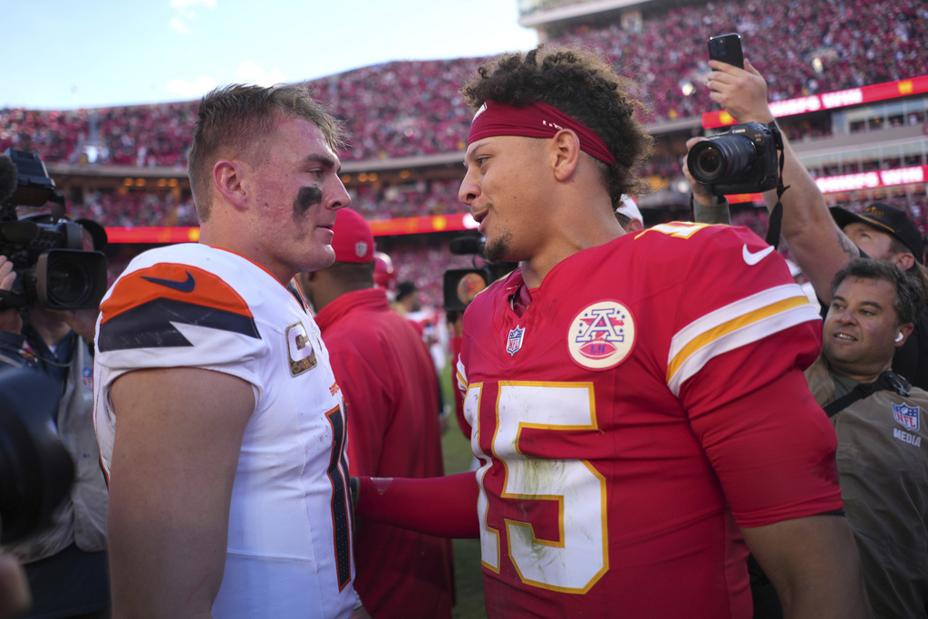 Broncos QB Bo Nix and Chiefs QB Patrick Mahomes speak after an NFL football game.