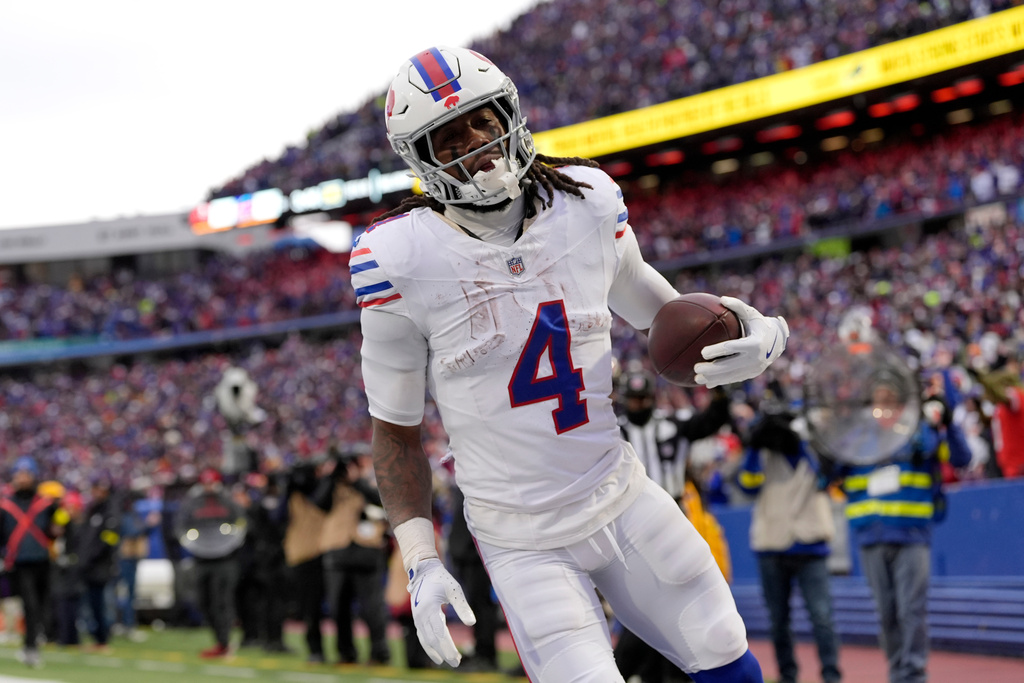 Buffalo Bills RB James Cook scores a TD in a game against the Buccaneers.