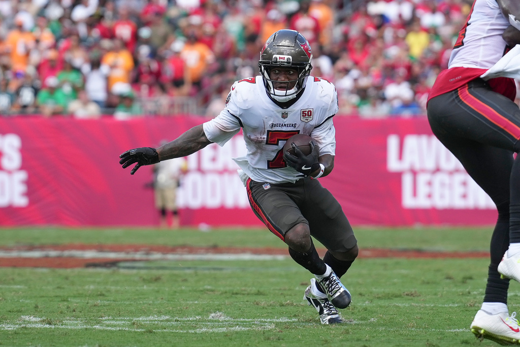 Tampa Bay Buccaneers RB Bucky Irving runs with the ball in a game against the Eagles.
