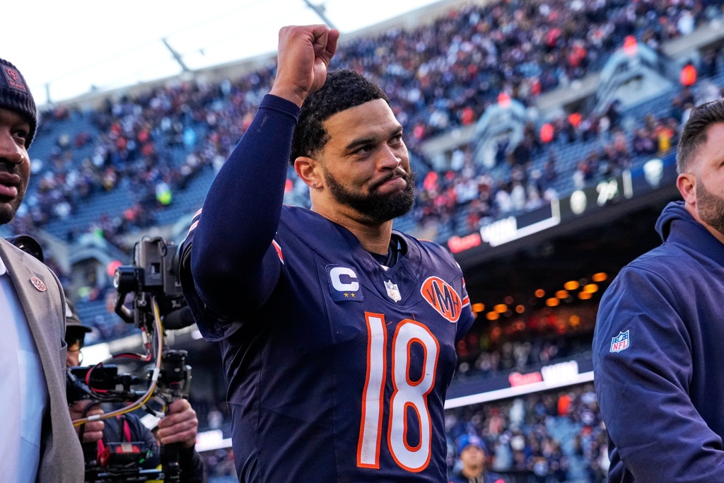 Bears QB Caleb Williams celebrates at an NFL game.
