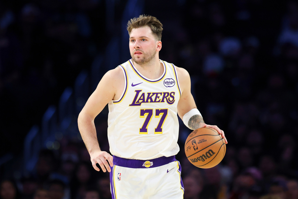 Lakers G Luka Doncic dribbles a basketball in an NBA game.