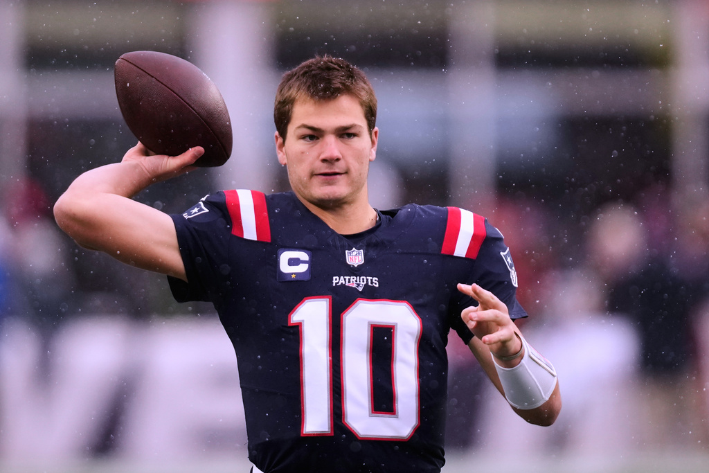 New England Patriots QB Drake Maye warms up before a game against the Buffalo Bills.