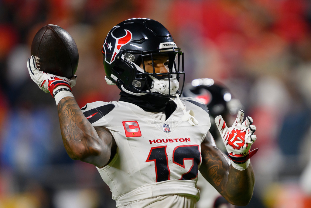 Texans WR Nico Collins warms up before an NFL football game.