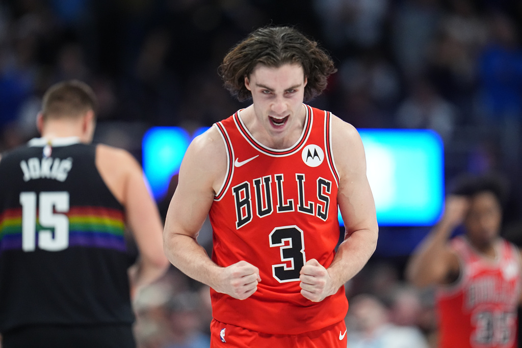 Bulls PG Josh Giddey celebrates in an NBA game. Giddey is questionable for Tuesday, January 20 game vs. the Clippers.