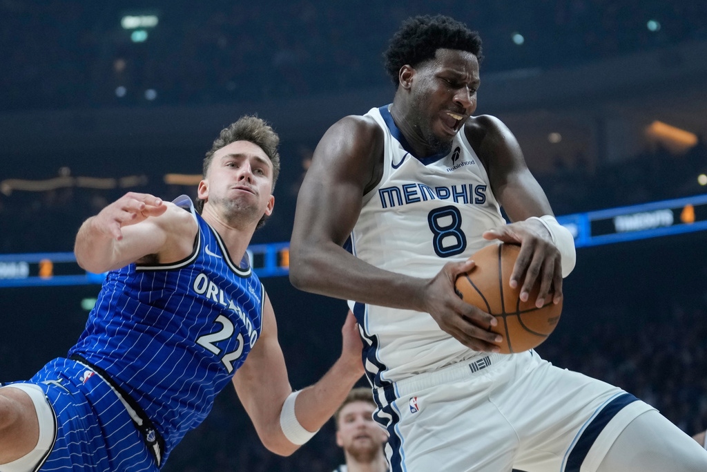 Grizzlies PF Jaren Jackson Jr. rebounds during an NBA game.