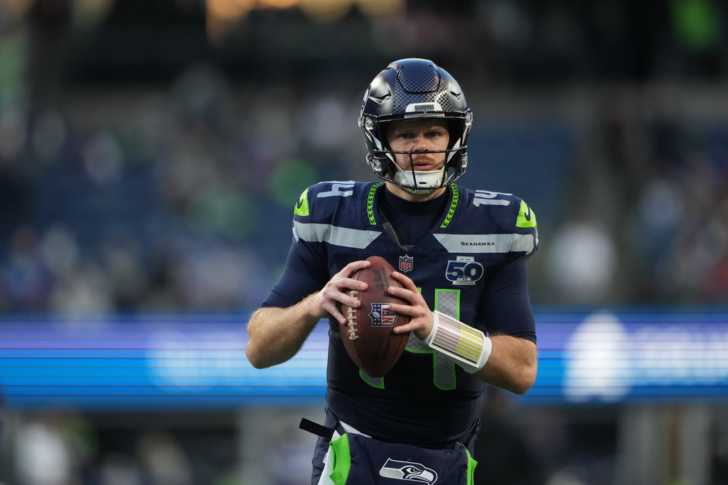 Seattle Seahawks QB Sam Darnold warms up before a playoff game against the San Francisco 49ers.