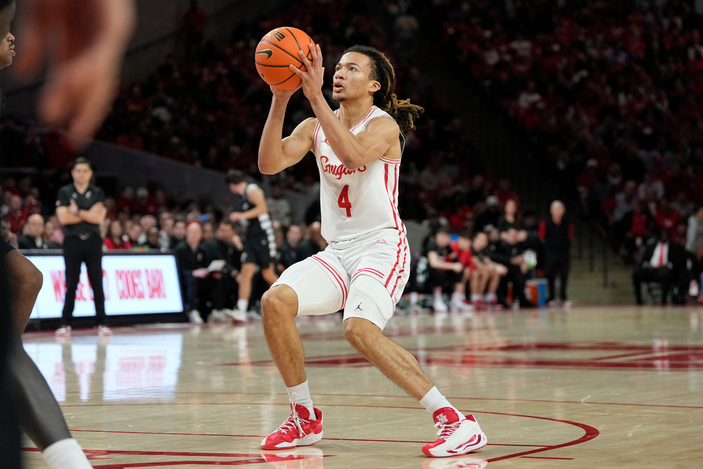 Houston G Kingston Flemings shoots a basketball in a CBB game.