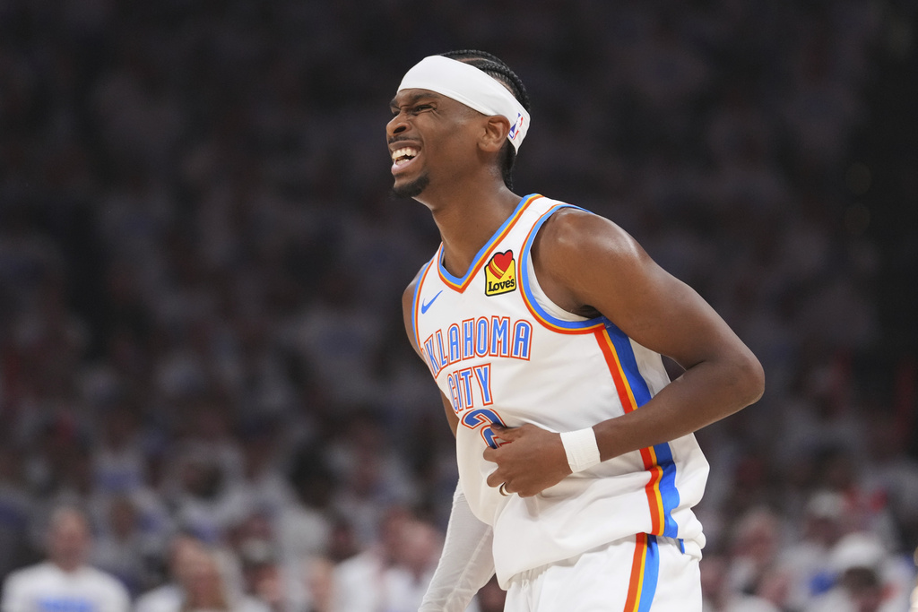 Thunder PG Shai Gilgeous-Alexander reacts to an injury after shooting in an NBA game.