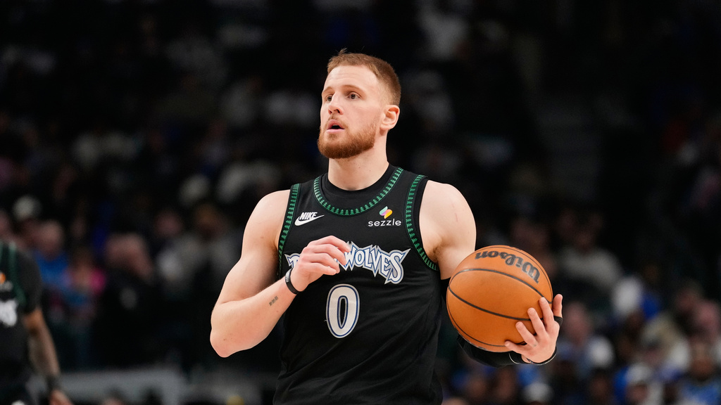 Minnesota Timberwolves SG Donte DiVincenzo looks to make a pass against the Dallas Mavericks.