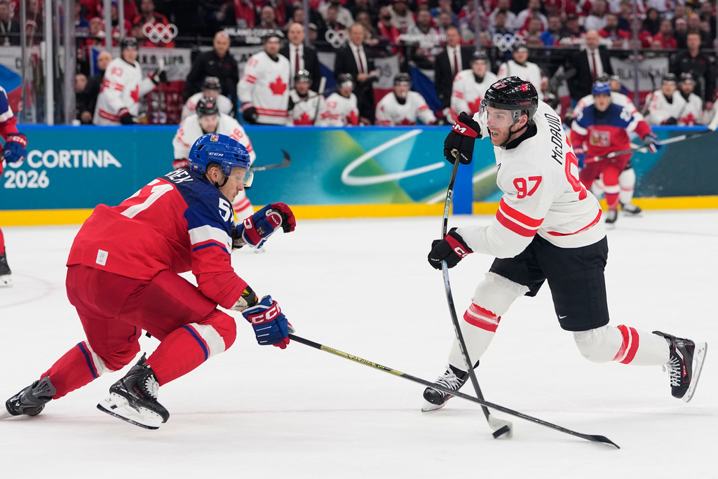Canada's Connor McDavid fires a shot in a 2026 Olympic hockey game vs. Czechia.