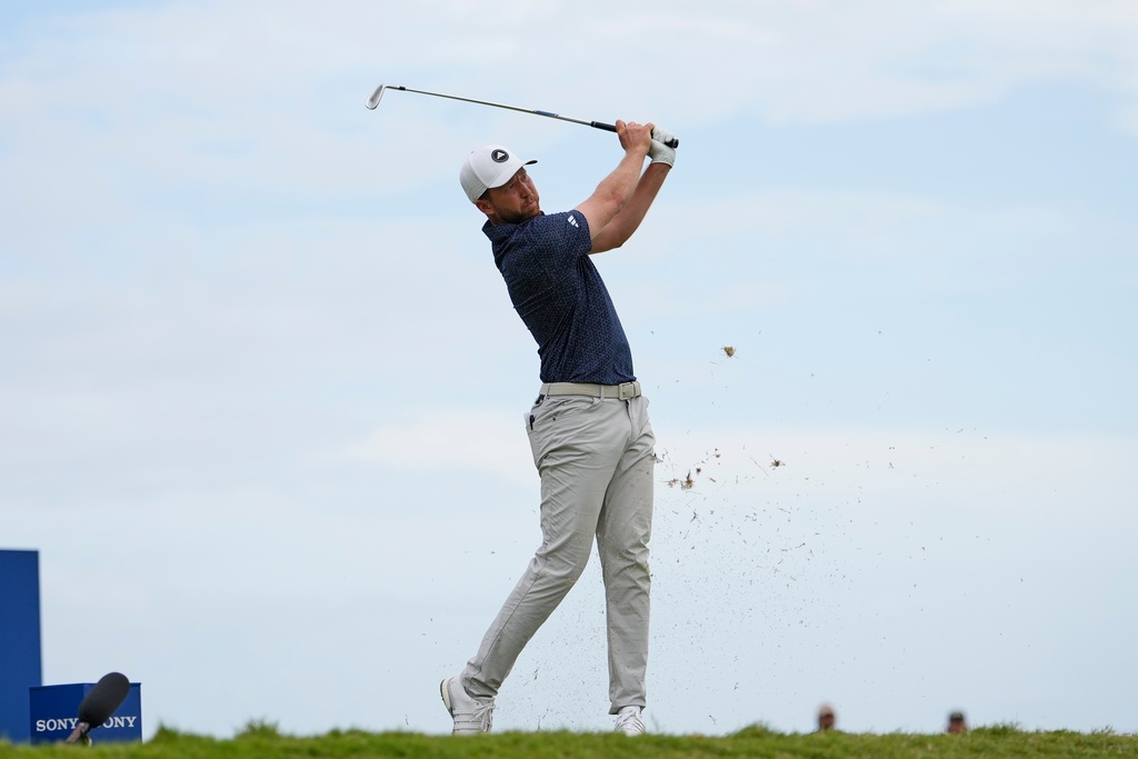 Daniel Berger hits a golf ball in a PGA tournament.