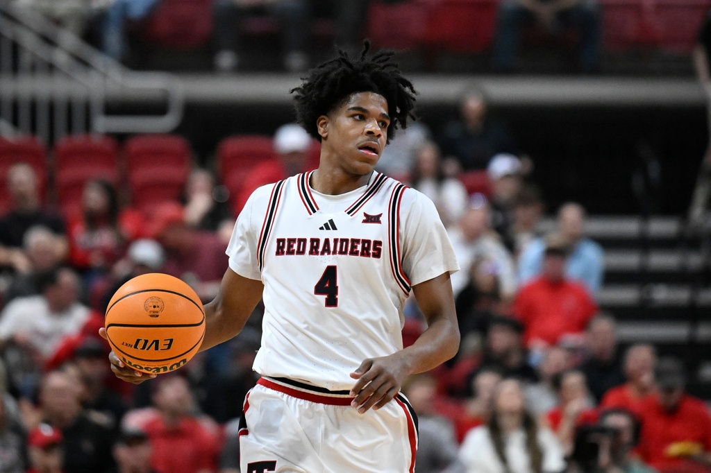 Texas Tech Red Raiders G Christian Anderson dribbles up the court against the Cincinnati Bearcats.