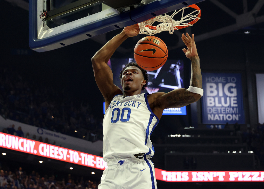 Kentucky basketball big man Otega Oweh dunks in a NCAA college basketball game.